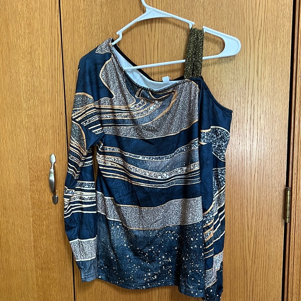 NWT blue and gold one shoulder long sleeve top. Blingy and stylish.